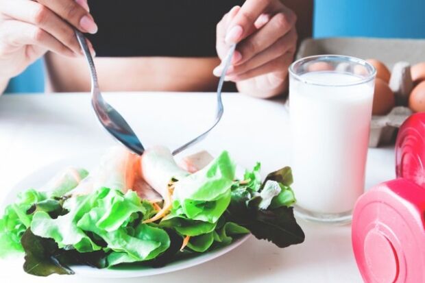 Salad and glass of yogurt